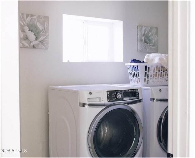 laundry room featuring washing machine and dryer