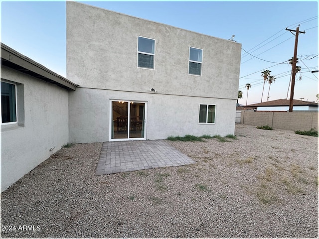 rear view of house featuring a patio