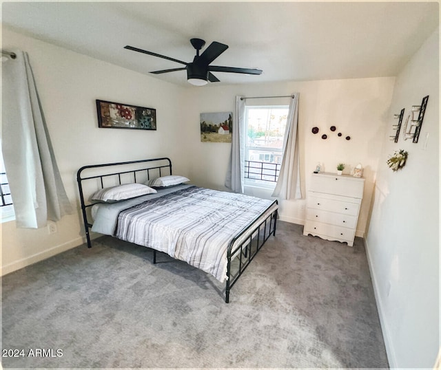 bedroom with ceiling fan and carpet floors