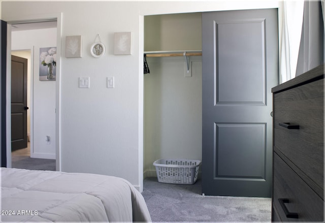 carpeted bedroom with a closet