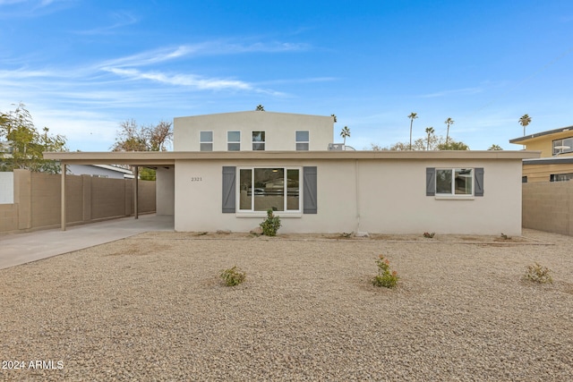 view of front of home with a carport