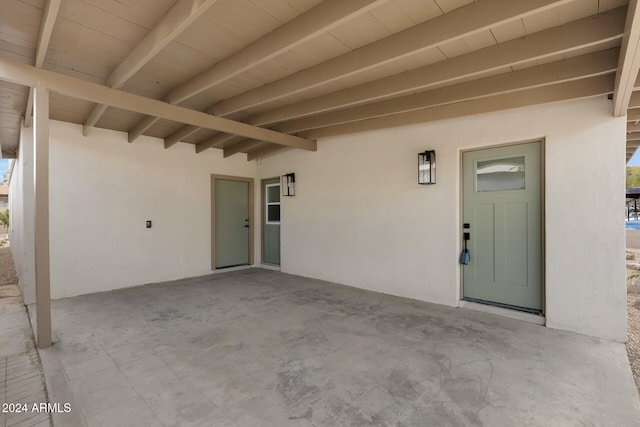 entrance to property with a patio area