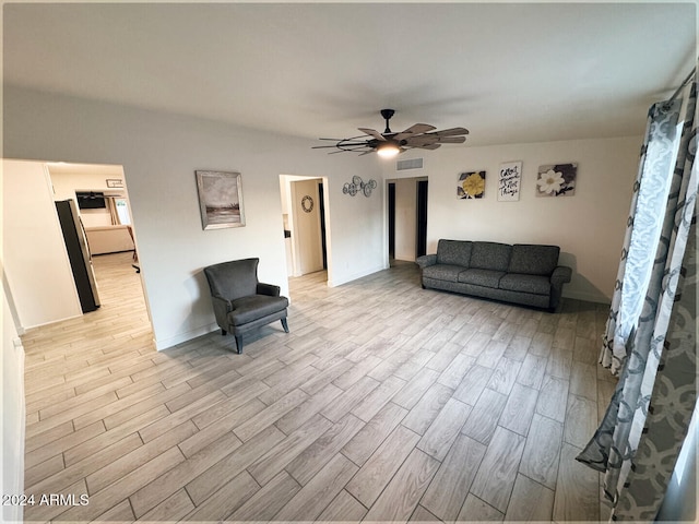 unfurnished living room with light hardwood / wood-style floors and ceiling fan