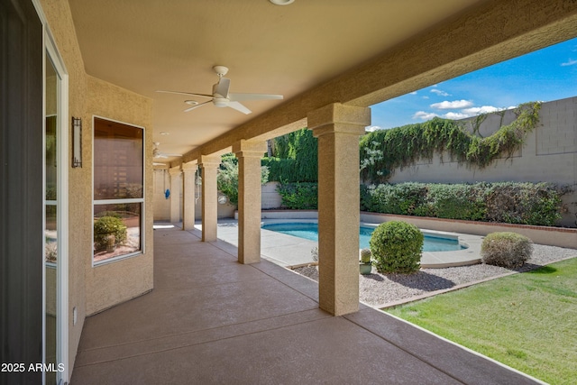 view of patio / terrace featuring ceiling fan, a fenced backyard, and a fenced in pool