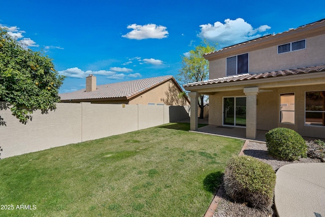 view of yard featuring a patio and fence