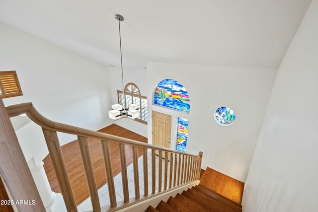 stairway featuring wood finished floors