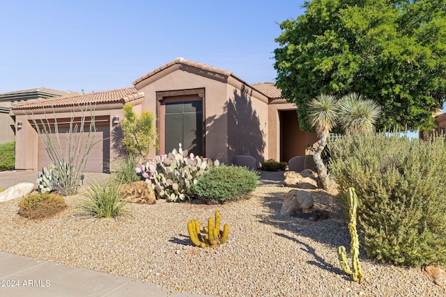 view of front of property featuring a garage