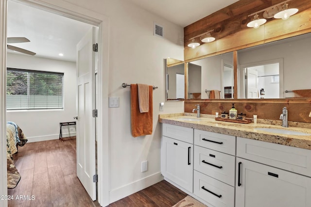 bathroom featuring vanity, hardwood / wood-style flooring, and ceiling fan