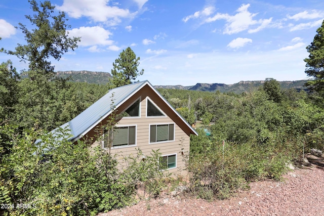 view of home's exterior with a mountain view