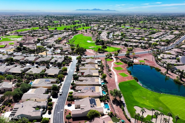 birds eye view of property featuring a water and mountain view