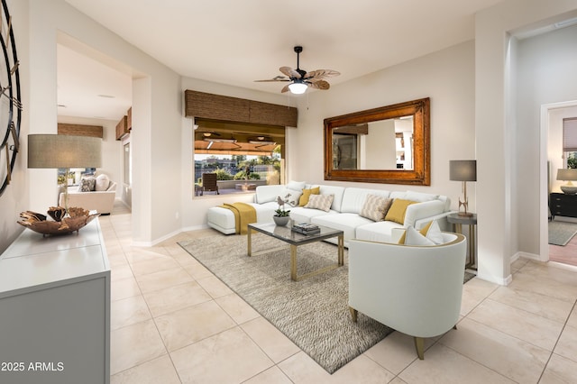 living room with ceiling fan and light tile patterned flooring