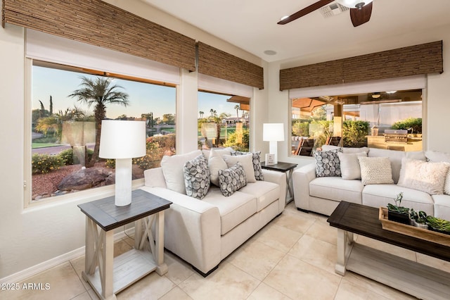 sunroom featuring ceiling fan