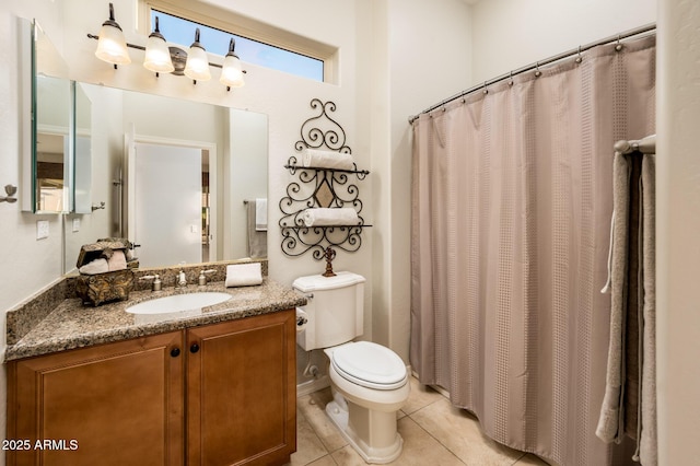 bathroom featuring tile patterned floors, vanity, and toilet