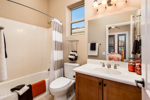 full bathroom featuring shower / bath combo, vanity, toilet, and a wealth of natural light