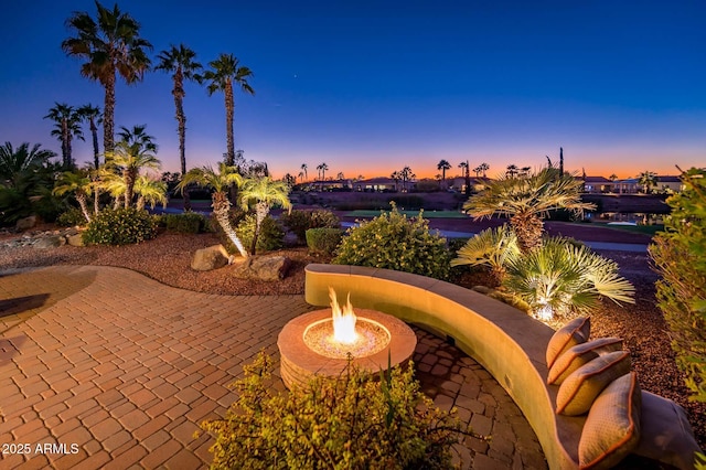 patio terrace at dusk with an outdoor fire pit