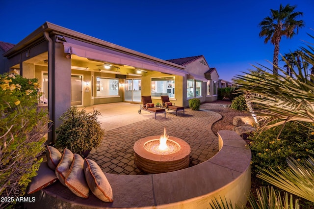 view of patio with an outdoor fire pit