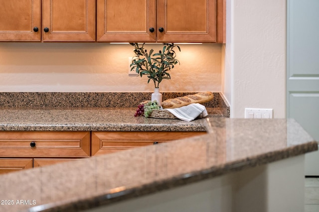 room details featuring stone countertops