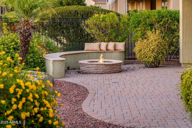 view of patio / terrace featuring an outdoor fire pit