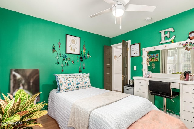 bedroom featuring hardwood / wood-style flooring and ceiling fan