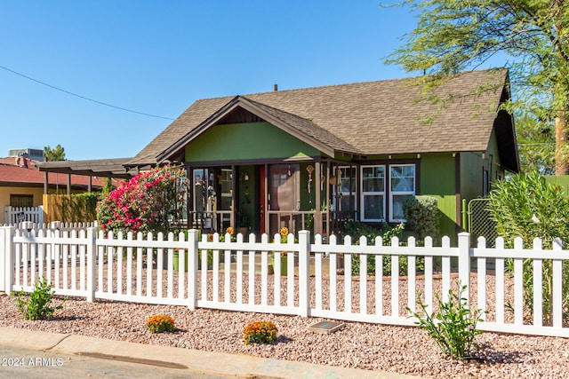 view of front of home with a sunroom