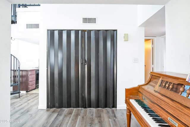 misc room with light hardwood / wood-style floors