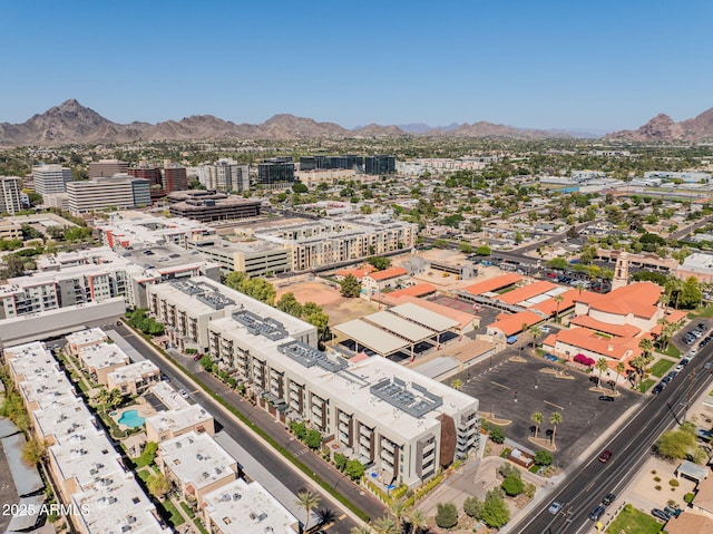 drone / aerial view featuring a city view and a mountain view