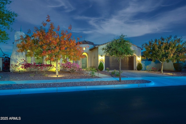 4571 N Arbor Way, Buckeye, AZ 85396 - view of front of home featuring an attached garage, driveway, and stucco siding