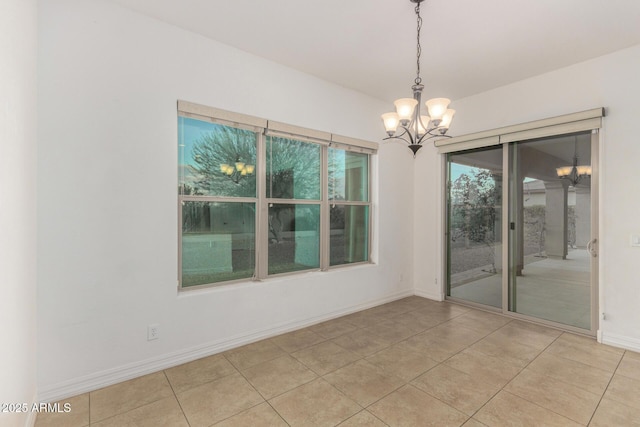 4571 N Arbor Way, Buckeye, AZ 85396 - spare room featuring a chandelier, baseboards, and light tile patterned floors