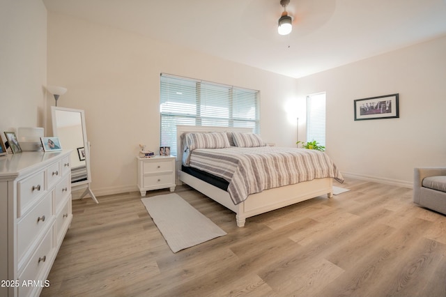4571 N Arbor Way, Buckeye, AZ 85396 - bedroom featuring light wood finished floors, baseboards, and ceiling fan
