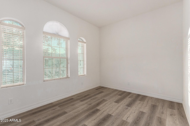 4571 N Arbor Way, Buckeye, AZ 85396 - unfurnished room with light wood-style flooring and baseboards