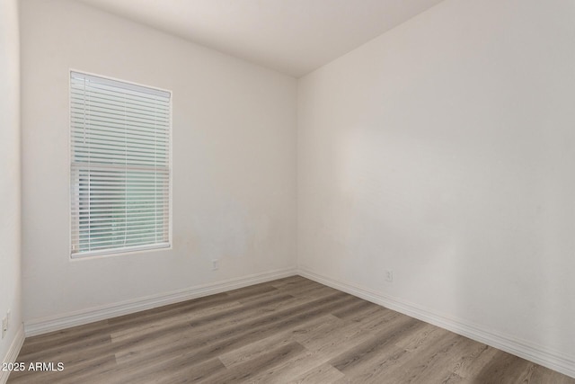 4571 N Arbor Way, Buckeye, AZ 85396 - spare room with light wood-style flooring and baseboards