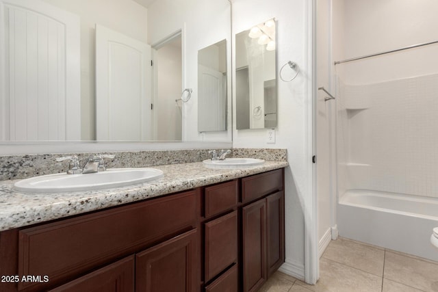 4571 N Arbor Way, Buckeye, AZ 85396 - bathroom featuring double vanity, tile patterned floors, bathing tub / shower combination, and baseboards