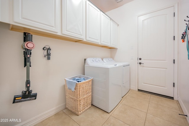 4571 N Arbor Way, Buckeye, AZ 85396 - laundry area featuring cabinet space, washer and clothes dryer, light tile patterned floors, and baseboards