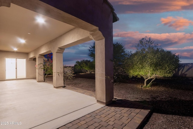 4571 N Arbor Way, Buckeye, AZ 85396 - patio terrace at dusk featuring a patio