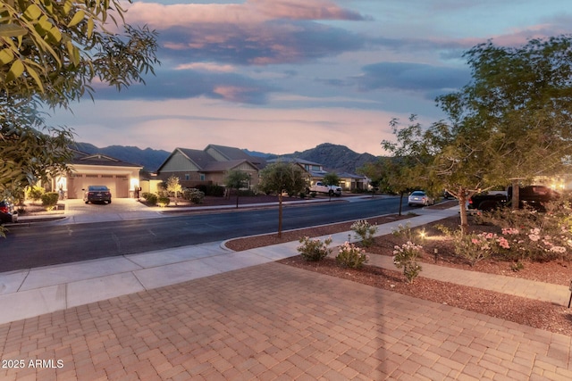 4571 N Arbor Way, Buckeye, AZ 85396 - pool at dusk with a mountain view