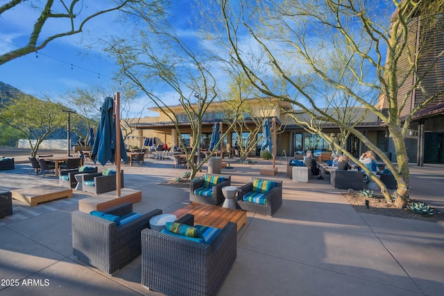 4571 N Arbor Way, Buckeye, AZ 85396 - view of home's community with a patio area and an outdoor hangout area