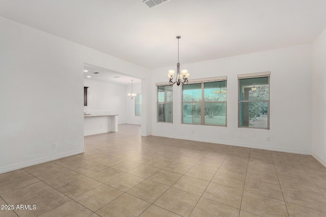 4571 N Arbor Way, Buckeye, AZ 85396 - unfurnished room featuring a chandelier, light tile patterned floors, and baseboards
