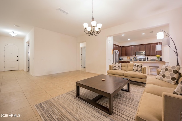 4571 N Arbor Way, Buckeye, AZ 85396 - living room featuring a chandelier, light tile patterned flooring, recessed lighting, and baseboards