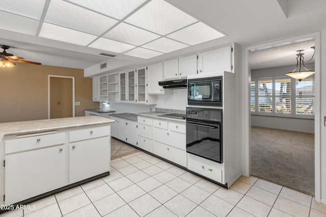 kitchen featuring light carpet, pendant lighting, ceiling fan, white cabinetry, and black appliances