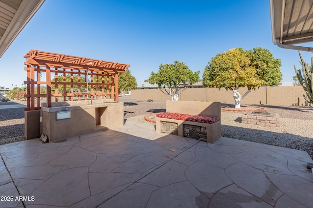 view of patio with a fire pit and a pergola