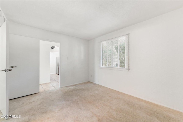 empty room with light colored carpet