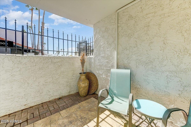 view of patio with a balcony