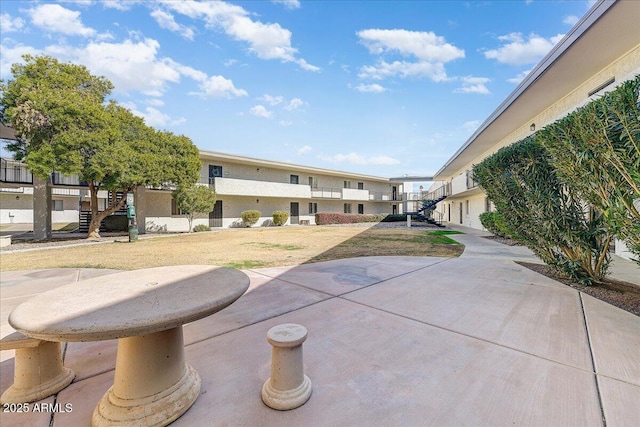 surrounding community featuring a patio