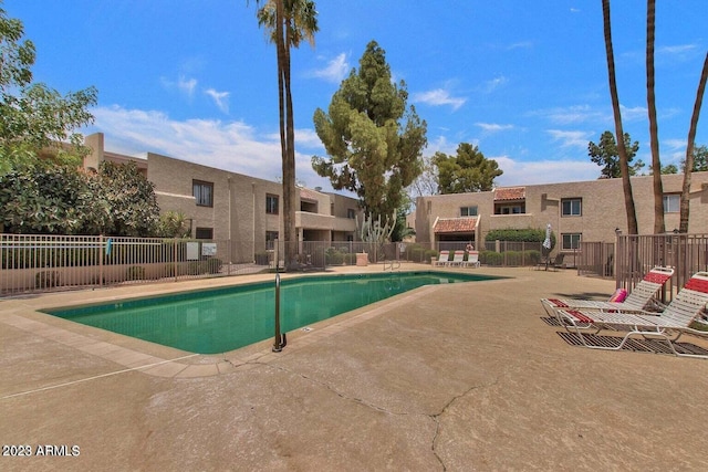 view of swimming pool with a patio area