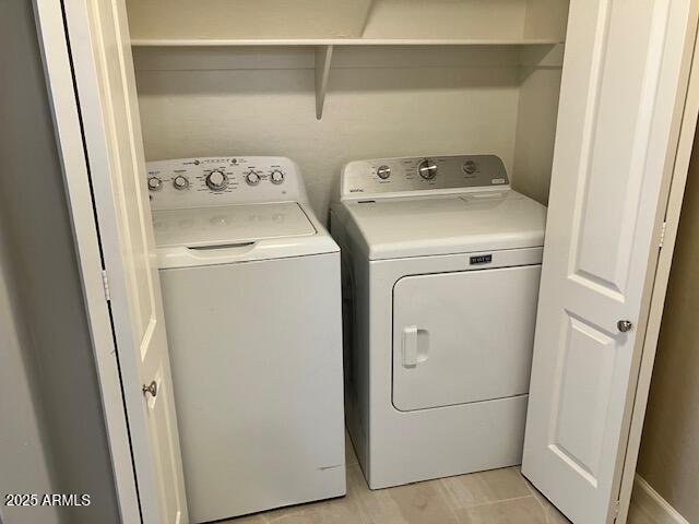 laundry room featuring laundry area and washing machine and dryer
