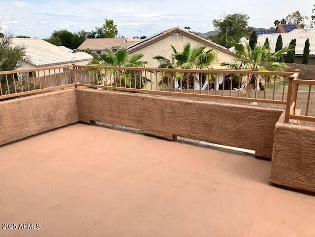 view of patio featuring a balcony