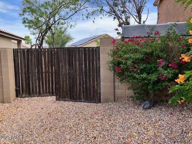 view of gate with fence