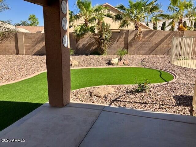 view of yard featuring a fenced backyard and a patio area