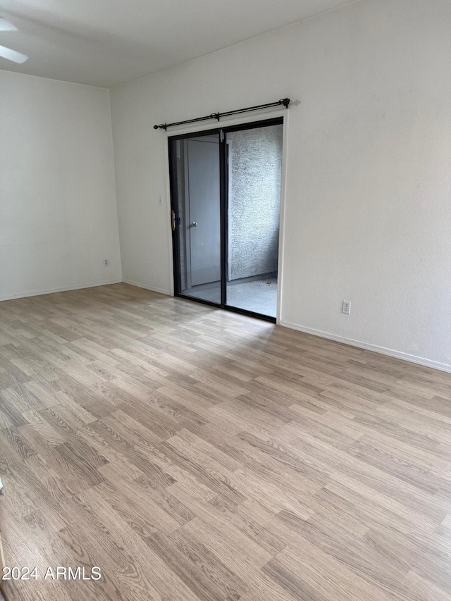 spare room featuring light wood-type flooring