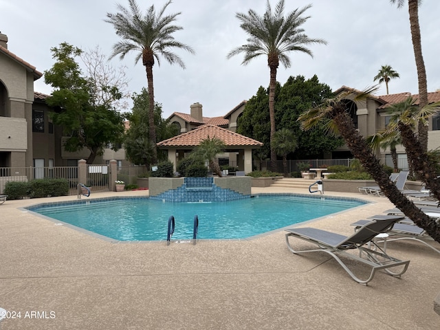 view of swimming pool featuring a patio area and a gazebo